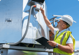 Worker testing a blower door.